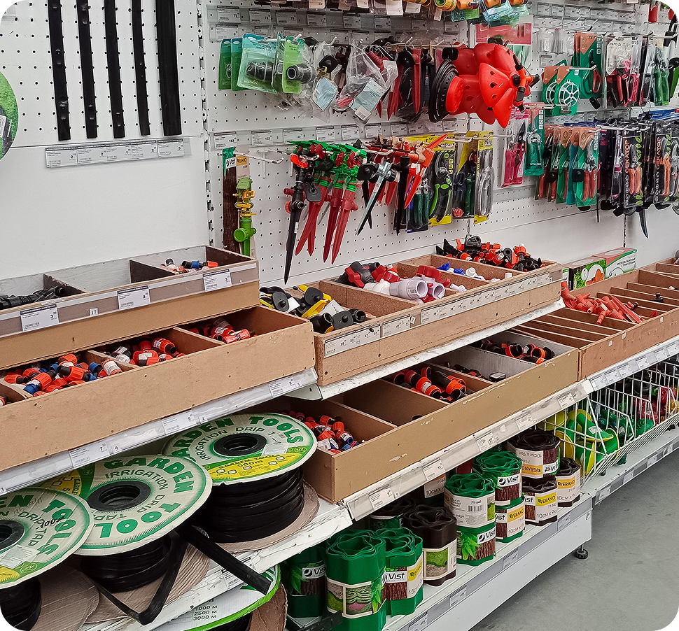 A well-organized hardware store aisle with fishing supplies and tools.